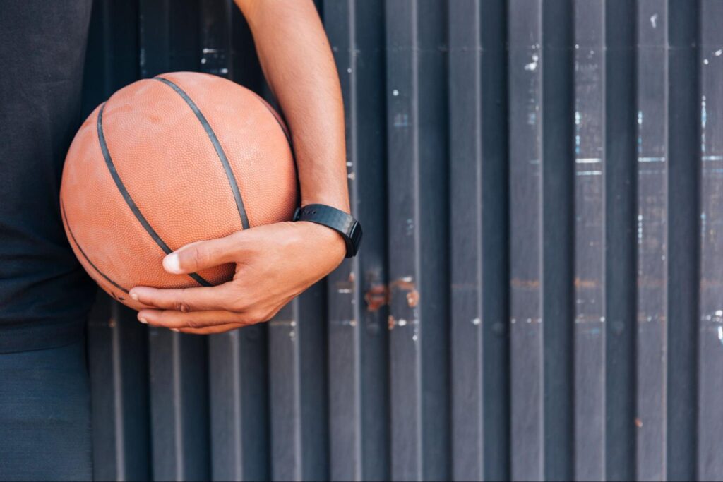 hand holding a basketball