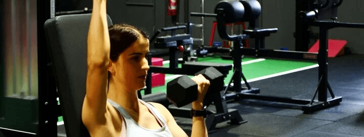 Female athlete lifting hand weights