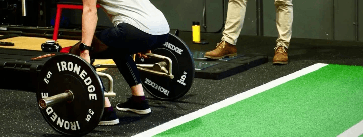 Woman lifting weights at the gym