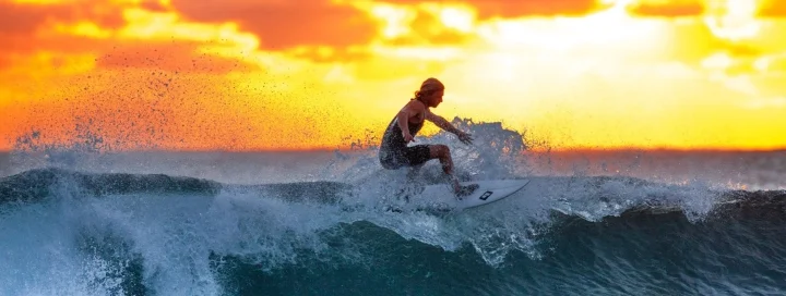 Surfing at sunset