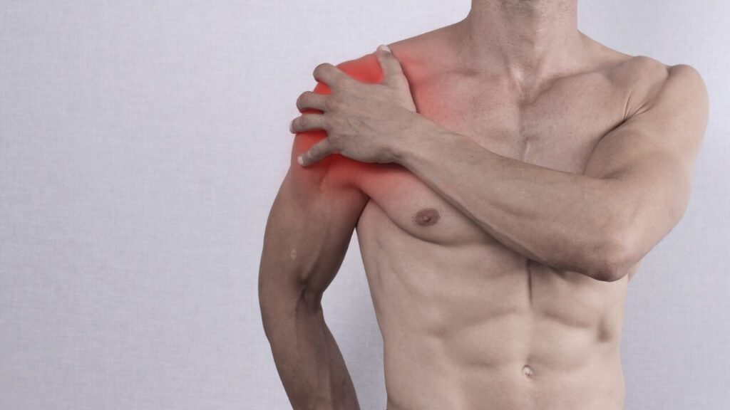 Topless male with highlighted shoulder pain