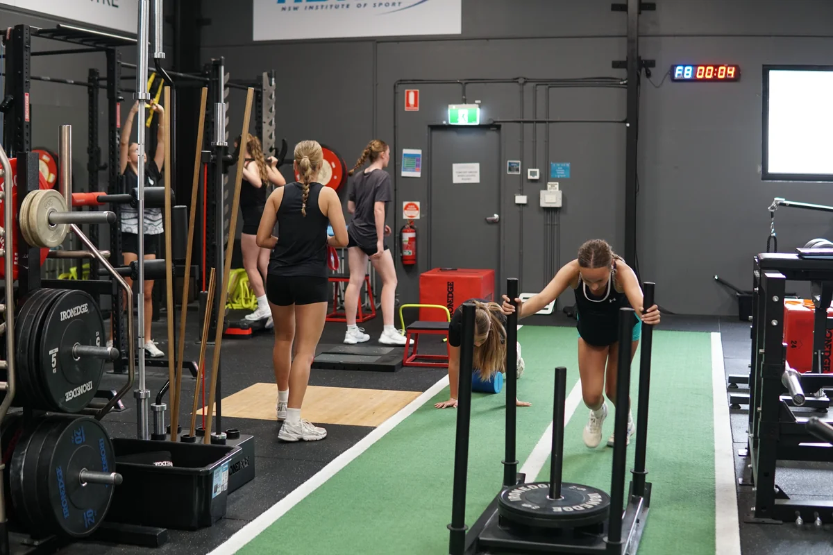 Athletes sled push workout