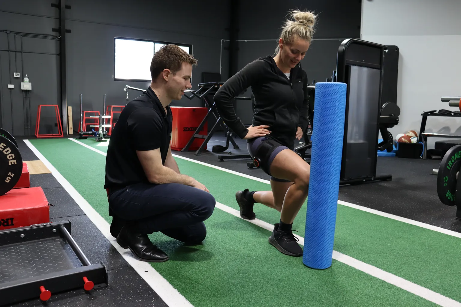 Physiotherapist assessing a patient's knee