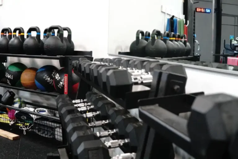 Kettlebells, medicine balls and dumbbells in a clinic gym