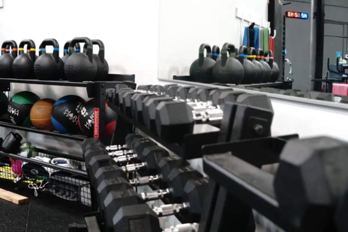 Kettlebells, medicine balls and dumbbells in a clinic gym